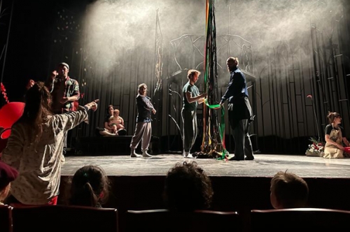 dancers on stage rehearsing 